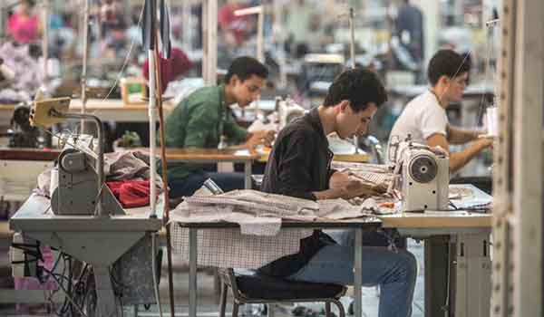 Egypt-Tailors sew at the Marie Louis textile factory about 60km outside of Cairo (AFP)