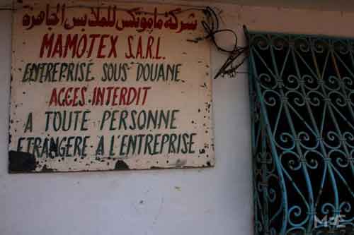 A sign in front of the Mamotex factory which reads: Mamotex Pret a Porter Company, Mamotex Limited Liability Company, No entry. Authorised Personnel Only (MEE/Alessia Tibolo)