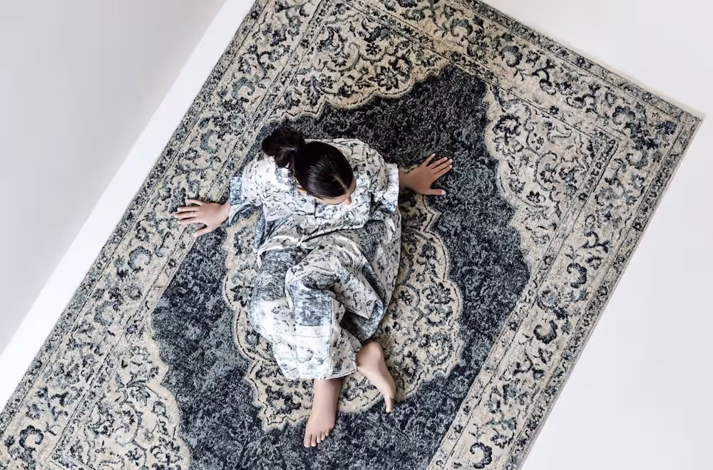 oriental-weavers-new-collections-a-girl-on-beautiful-machine-made-carpet-made-in-Egypt-export-to-usa-market
