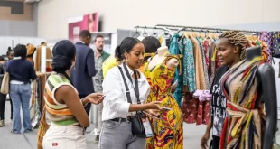 An attendee engages with exhibitors at the (EATLW) hosted at the Sarit Expo Centre.