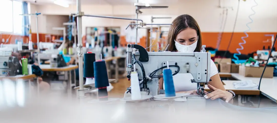 Worker sewing in a textile factory-Turkish Local Textile Industry