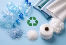 Syntetica Raises $30 Million to Scale Nylon Textile Recycling Technology Recycled polyester fiber made from plastic bottles with PET flakes, yarn, textile fabric and recycling symbol on blue background.