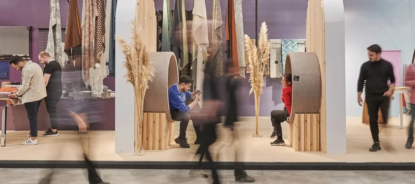 HOMETEX 2025 exhibition halls with textile displays and global brand booths in Istanbul