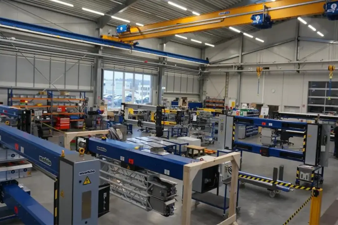 Mahlo factory building with engineers working on textile measurement machines and innovation in Germany