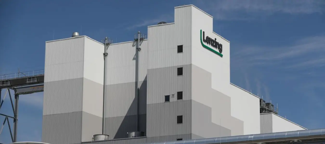 Lenzing Group Highlights Scalable, Bio-based Nonwovens Solutions at Leading Global Industry Fairs Lenzing Group headquarters with financial growth chart overlay