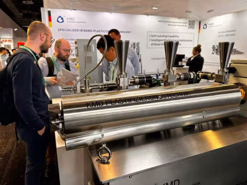 KMD benchtop extrusion and fiber spinning laboratory machine displayed at K Show Germany, demonstrating compact polymer processing technology.