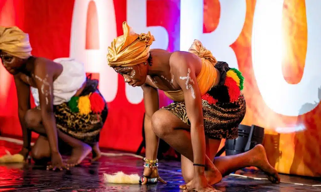A photo from AfroTalks Lagos 2025 showing African innovators and creatives on stage during panel discussions and AfroPitch presentations.