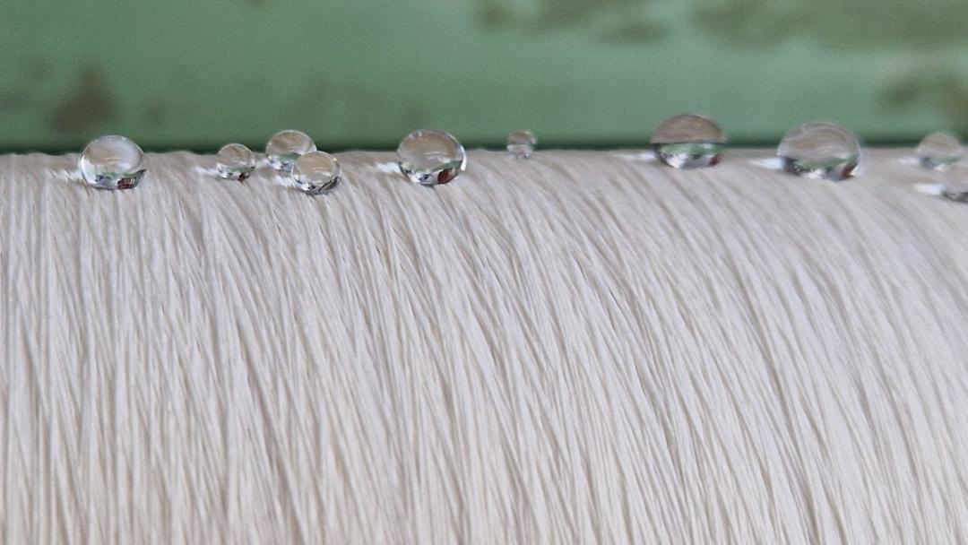 Researchers develop PFAS-free textile coatings using plasma technology, enabling sustainable water-repellent fabrics.