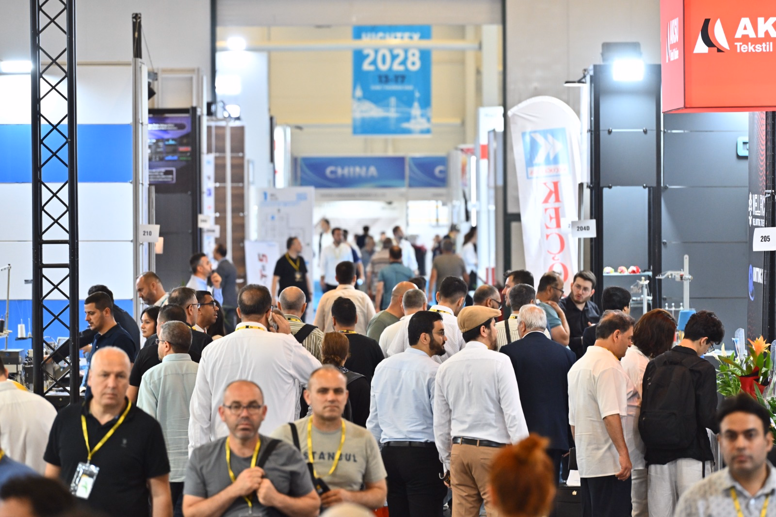 Visitors explore textile machinery and automation technologies during ITM 2026 in Istanbul.