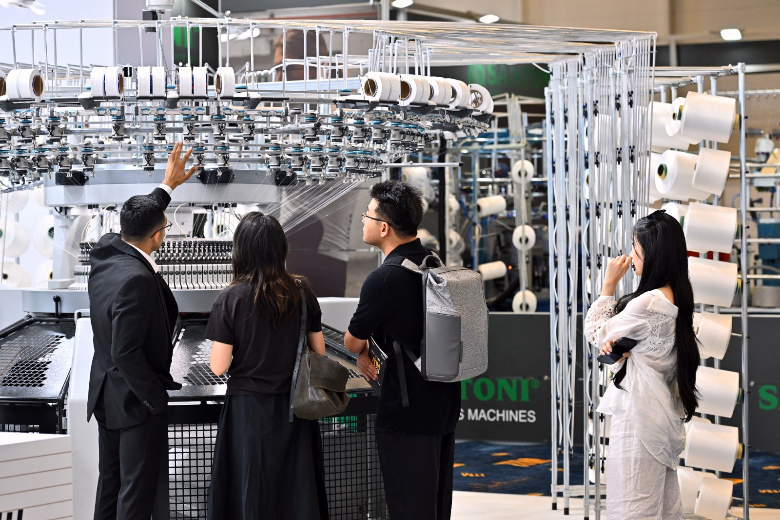 Visitors explore textile machinery and automation technologies during ITM 2026 in Istanbul.