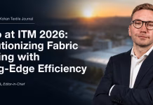 Bianco at ITM 2026: Revolutionizing Fabric Finishing with Cutting-Edge Efficiency Giuseppe Benigni of Bianco at ITM 2026 discussing cutting-edge efficiency in fabric finishing, with the company’s industrial facility blurred in the background.