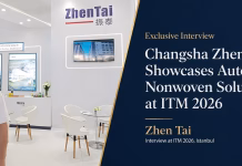 Changsha Zhentai Showcases Automated Nonwoven Solutions at ITM 2026 Zhen Tai representative at ITM 2026 standing in front of the Changsha Zhentai booth, highlighting automated nonwoven machinery solutions and expansion in Türkiye and surrounding markets.