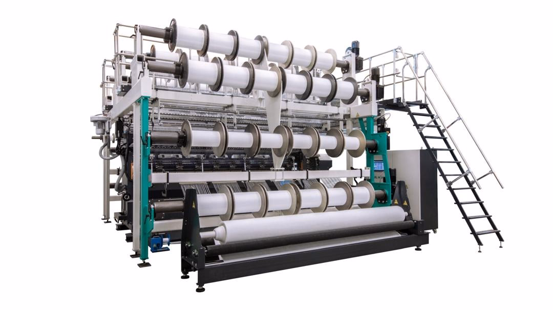 KARL MAYER RDJ 7/3 spacer fabric machine producing jacquard spacer textiles for athletic footwear.